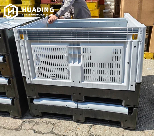 Huading foldable pallet containers with sidewalls folded flat for compact empty storage and return transport